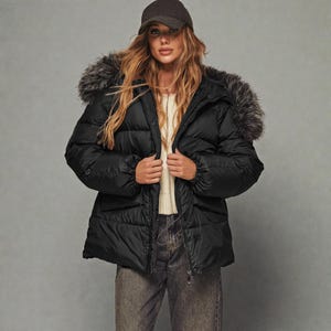 This premium winter collection features water-repellent polyester coats designed for extreme cold. Models include a quilted maxi jacket rated for -15°C with silicone 200 and bio-down puffers handling temperatures down to -20°C. Features include non-removable hoods, detachable fur, and adjustable drawstrings for a custom silhouette. Functional pockets and zip-and-button closures ensure a cozy winter outlook. Stay warm! ❄️🧥