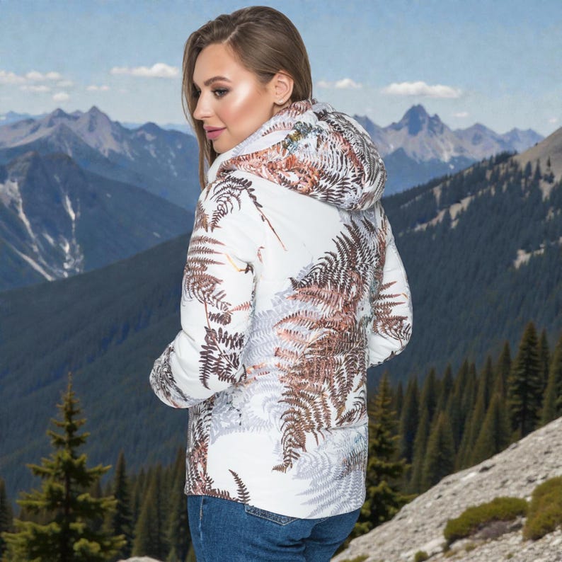 This white puffer jacket blends high-fashion botanical prints with functional design, keeping you comfortable in temperatures down to -5C.

Top Performance Specs
❄️ Insulation: Premium Biosilicone 120 mm for a light down jacket feel.
❄️ Weatherproof: Durable, waterproof raincoat fabric (100% polyester).
❄️ Closure: Unique voluminous diagonal zip puffer coat.
❄️ Collar: High stand-up style for wind protection.
❄️ Utility: Convenient slit pockets and decorative sleeve zippers.