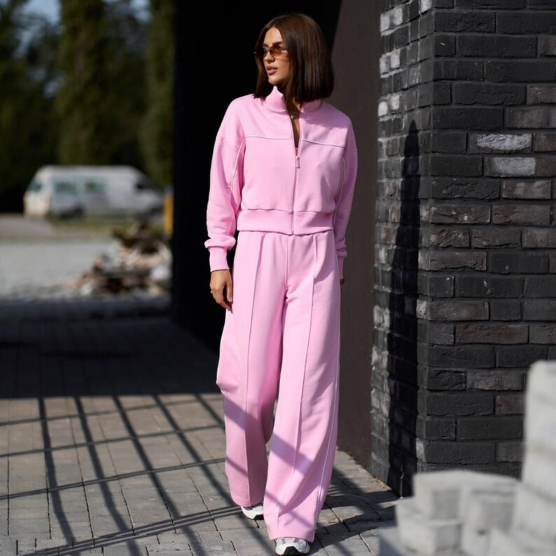💫Effortless Style with Our Women's Two-Piece Set of Hoodie and Palazzo! 💫

✨Fabric - Peyne (3-thread loop)
90% Сotton, 10% polyester

Set includes: Hoodie and Palazzo pants

Step into the ultimate comfort and style with this versatile women's tracksuit. This isn't just a basic loungewear; it's a chic streetwear women set that's perfect for both relaxed days and running errands. This beautiful two-piece women set doubles as a cozy outfit and a fashionable statement piece.