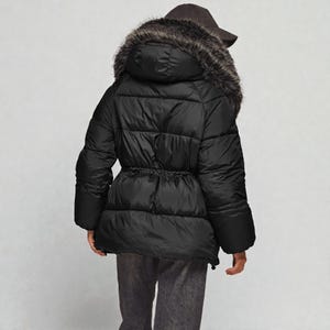 This premium winter collection features water-repellent polyester coats designed for extreme cold. Models include a quilted maxi jacket rated for -15°C with silicone 200 and bio-down puffers handling temperatures down to -20°C. Features include non-removable hoods, detachable fur, and adjustable drawstrings for a custom silhouette. Functional pockets and zip-and-button closures ensure a cozy winter outlook. Stay warm! ❄️🧥