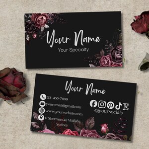 May include: Black business cards with floral designs and the text "Your Name" and "Your Specialty". One card features contact details: phone, email, website, and social media. Dried roses are in the background.