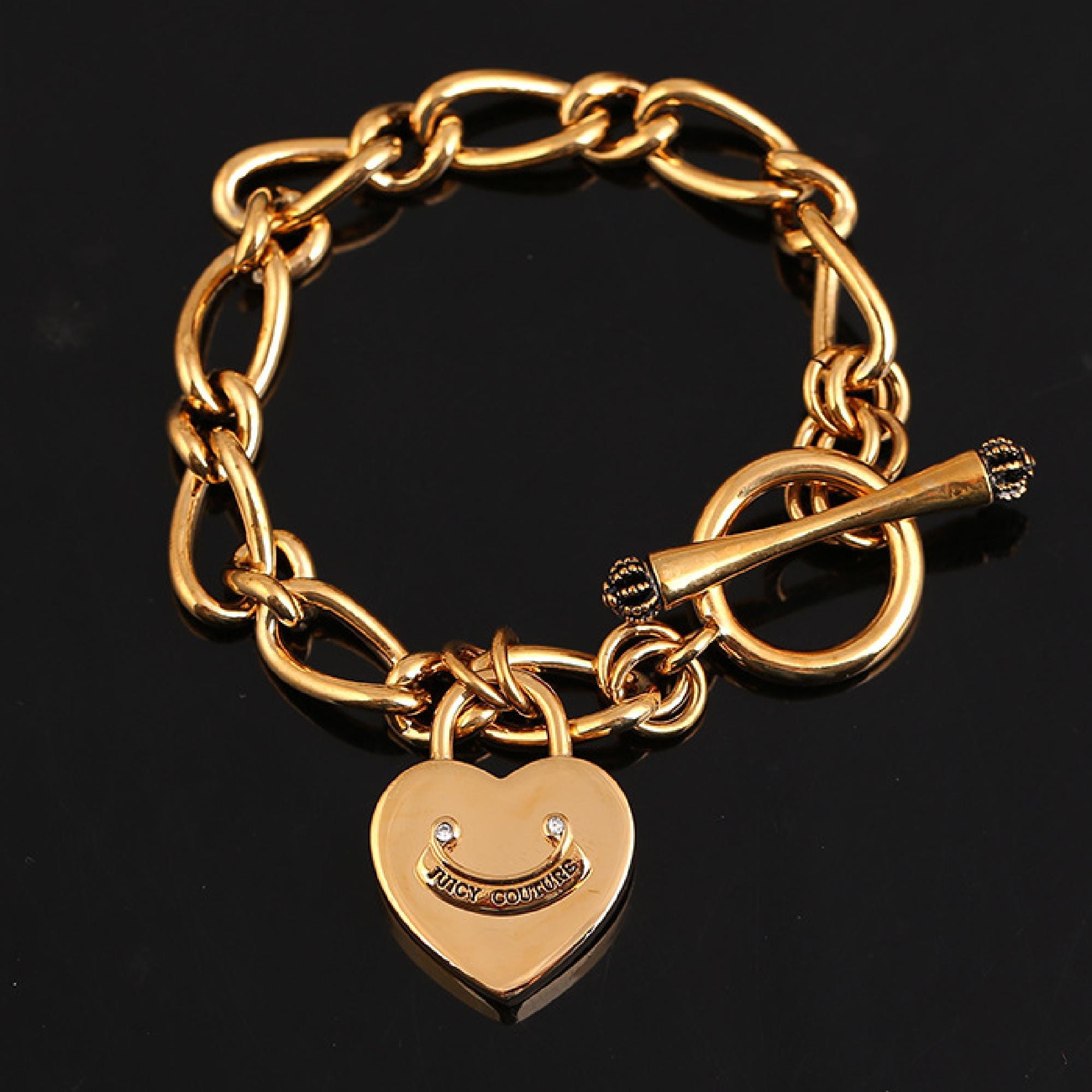 Juicy Couture gold heart padlock crown toggle bracelet.
