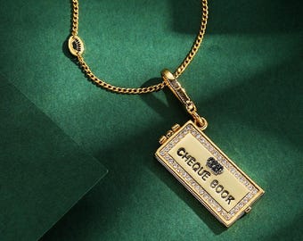 Juicy Couture Cheque Book charm necklace.