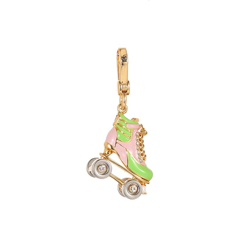 May include: A gold-toned roller skate charm with pink and green enamel detailing. The charm features silver wheels with clear crystal accents and a gold clasp. The roller skate has a chain detail and is suspended from a gold clasp.