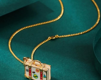 Juicy Couture openable handbag charm necklace.