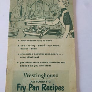 May include: Vintage Westinghouse Fry Pan Recipes booklet. The cover features an illustration of a family enjoying a meal. The text reads "new, modern way to cook" and "Fry Pan Recipes". The booklet is in good condition.