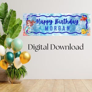 May include: A rectangular horizontal banner featuring a blue watercolor background with a dark blue wavy border. The text reads Happy Birthday MORGAN in blue. A mermaid, a red crab, and a yellow fish are illustrated on the banner. The text Digital Download is below.