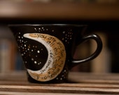 e.e. cummings "You are my sun, my moon, and all my stars" Literary Quote Mug - Medium fluted black mug with gold moon and stars