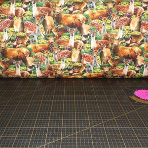 Oasis Fabrics. Wilderness. Stacked Deer DIGITAL PRINT