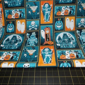 Henry Glass. Welcome Foolish Mortals. Patchwork Multi Glow in the Dark - Glow in the Dark Halloween Fabric designed by Shelly Comiskey