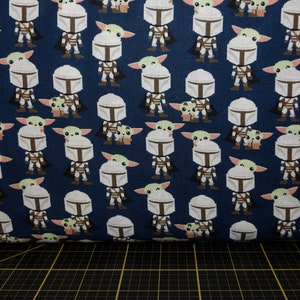 Camelot Fabrics. Star Wars Mandalorian. Mando Hello Friend Navy