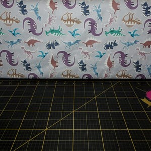 Lewis & Irene. Dino Glow. Dinosaurs Warm Grey w/Glow in the Dark Elements