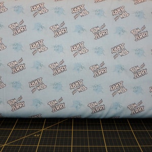 Camelot Fabrics. Tom & Jerry Logo Editorial Blue