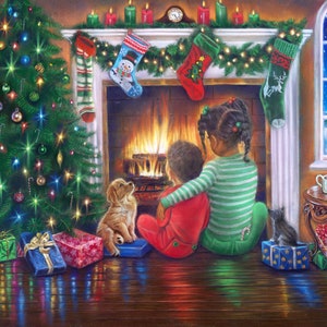 May include: Two children sit by a fireplace with a lit fire, a Christmas tree, and presents. The children are wearing pajamas and are looking at the fire. A dog and a cat are also in the room.