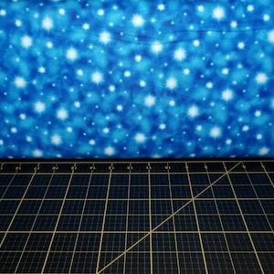 QT Fabrics. The Newborn King. Stars Blue
