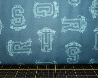 Camelot Fabrics. Wizarding World - HP. HP Houses Tonal in Light Teal