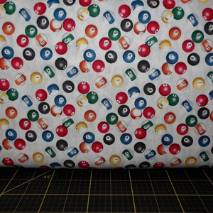 May include: White fabric with a repeating pattern of colorful billiard balls. The balls are numbered 1 through 15 and are arranged in a random pattern.