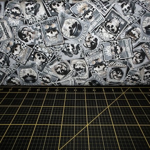 May include: Black and white fabric with a repeated pattern of skulls and motorcycle-themed designs. The fabric features words like "Freedom", "Classic", "Custom", and "Legendary".