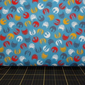 Camelot Fabrics. Star Wars. Logos and Masks Toss Blue