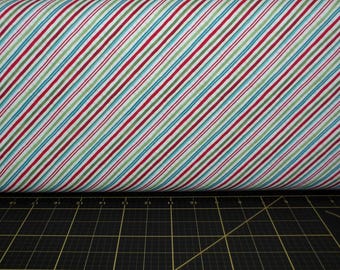 Northcott. Extreme Santa. Diagonal Stripe White