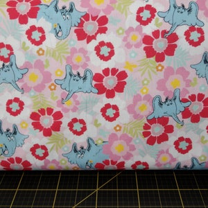 May include: Fabric with a repeating pattern of light blue elephants and red, pink, and yellow flowers on a white background. The fabric is likely cotton and suitable for quilting or other craft projects.