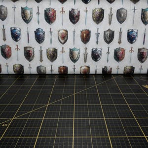 QT Fabrics. Wizards and Warriors. Swords and Shields Cream