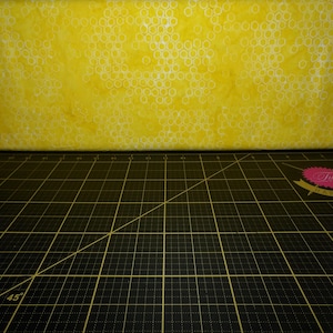 Anthology Fabrics. What&#39;s the Buzz. Honeycomb Yellow BATIK
