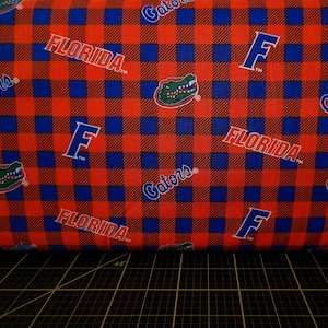 Sykel Enterprises. NCAA Florida Gators Buffalo Plaid Logo Toss