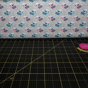 Camelot Fabrics. Literary. Typewriters Cream