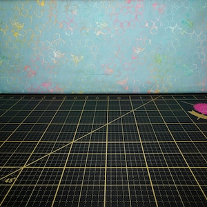 Anthology Fabrics. What&#39;s the Buzz. Beehive Soft Teal BATIK