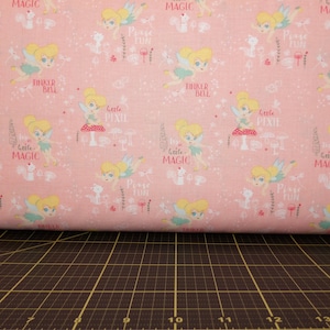 Camelot Fabrics. Peter Pan & Tinkerbell. Tinkerbell Pixie Magic Pink