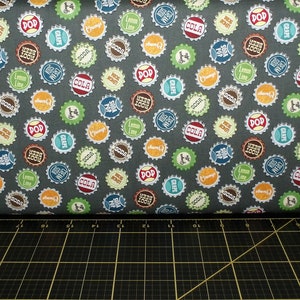 Blank Quilting. Adventure Awaits. Bottle Tops Gray