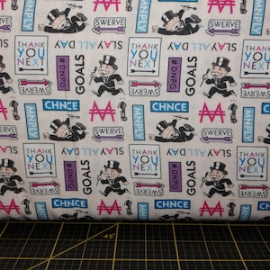 Camelot Fabrics. Hasbro Monopoly. Tossed Expressions Multi
