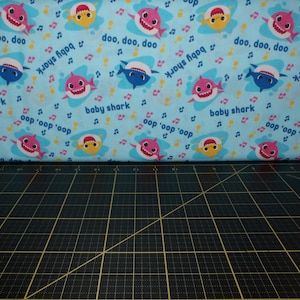 Springs Creative. Baby Shark. Music Toss Blue - Baby Shark Nursery Song Fabric