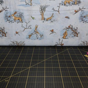 Clothworks. GHMILY 2020. Scenic Toile Denim - Guess How Much I Love You Fabric