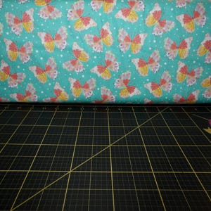 QT Fabrics. Confetti Blossoms. Butterflies Dk Seafoam