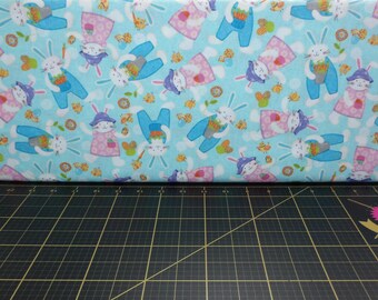 Studio E. Carrot Patch. Tossed Bunnies Blue - Easter Fabric