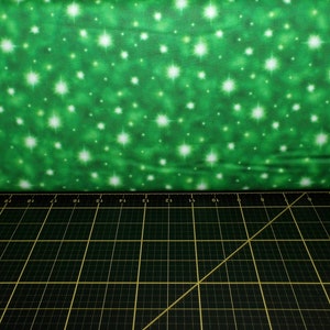 QT Fabrics. The Newborn King. Stars Green