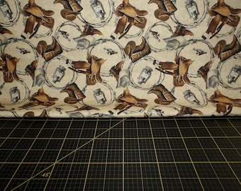 Blank Quilting. Cowboy Culture. Cowboy Boots and Hats Motifs Tan