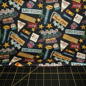 Blank Quilting. Adventure Awaits. Tossed Route 66 Icons Black