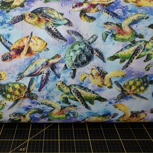 Oasis Fabrics. The Reef. Turtles Light Blue