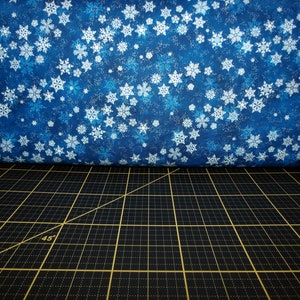 Northcott. Shimmer Frost. Blowing Snowflakes Dark Blue Silver