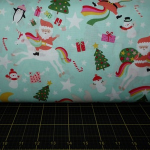 Alexander Henry. Christmas Time. Yuletide Unicorn Pale Aqua (this is more of a minty green background)