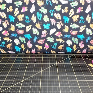 QT Fabrics. All Dolled Up. Shoe Toss Black - Beautician and Cosmetologist fabric