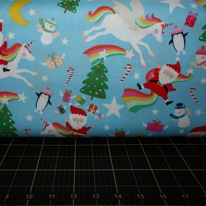 Alexander Henry. Christmas Time. Yuletide Unicorn Blue