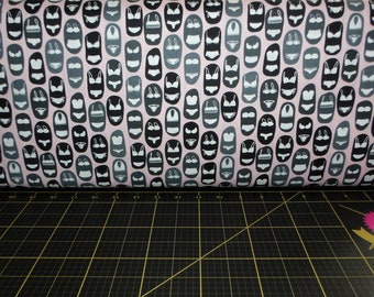 May include: Pink fabric with a repeating pattern of black and white lingerie silhouettes.