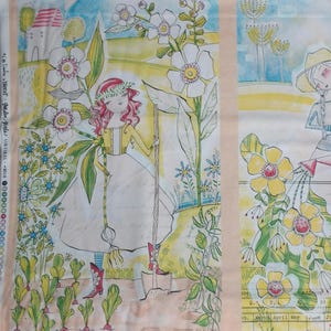 May include: A whimsical illustration of a girl with red hair wearing a wreath and a yellow dress, holding a gardening tool. She is standing in a garden with white flowers, green plants, and a small house in the background. The illustration is on a light beige background.