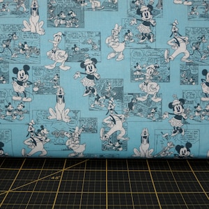 Springs Creative. Disney. Sensational 6 Comic Strip Blue - Vintage Donald Duck, Mickey Mouse, Minnie Mouse, and Pluto fabric