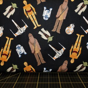 Camelot Fabrics. Star Wars. Tossed in Space Black