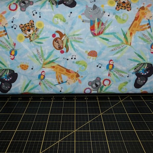 Clothworks. Jungle Drums. Animals Light Denim DIGITALLY PRINTED